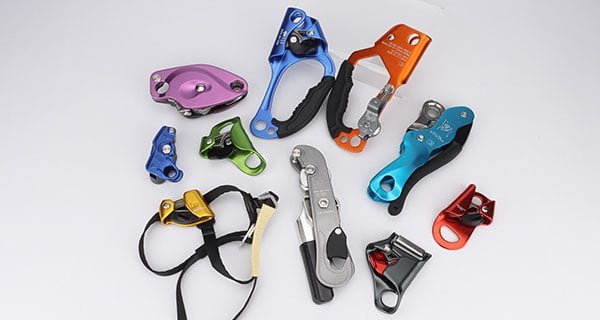 Rope ascent and descent devices including hand ascenders, chest ascenders and descenders