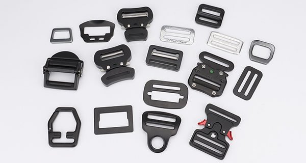 Harness buckles, adjusters and friction buckles for safety harnesses