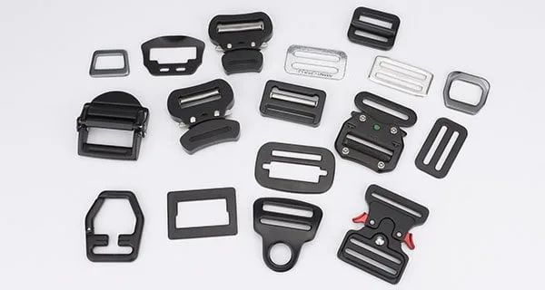 Harness buckles, adjusters and friction buckles for safety harnesses